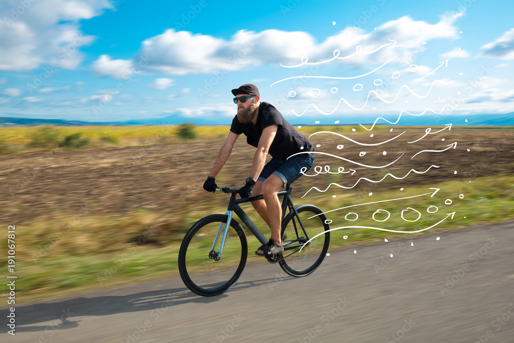 Fototapeta premium Fashion cyclist in the nature going somewhere