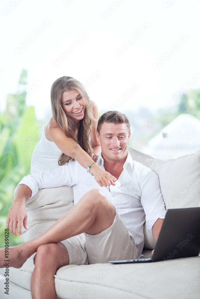 Obraz premium portrait of nice young couple in summer house environment