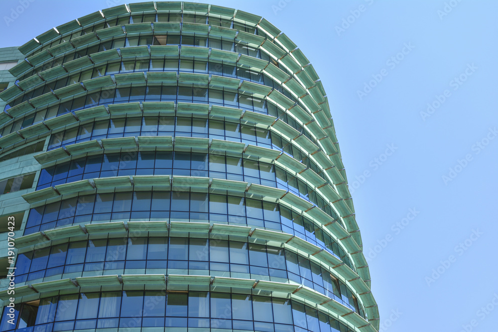 green building with offices and glass windows