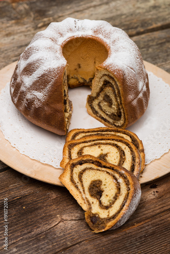 Potica/Potizza, Roll with walnuts on the festive table photo