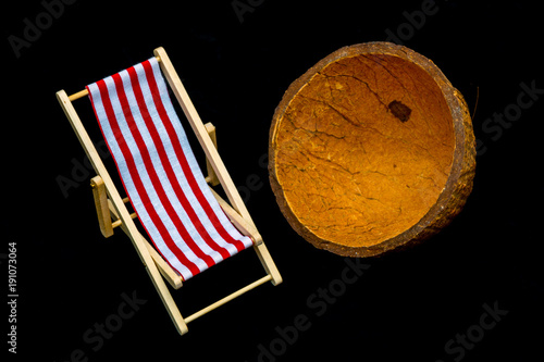 red striped chaise longue on a black background photo