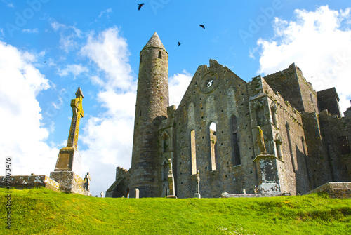 The Rock of Cashel in ireland with cross photo