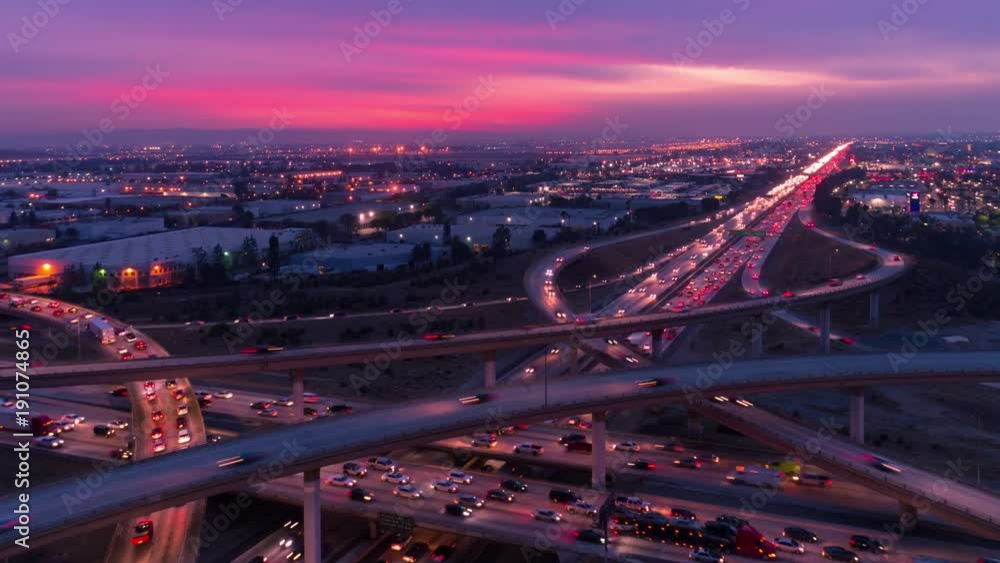 Time lapse of cars on freeway and highway with lights in heavy traffic at sunset