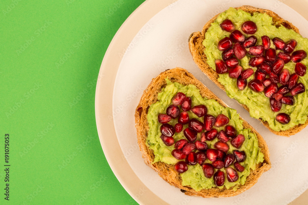 Avocado and Pomegranate Seeds Open Face Sandwich On Mediterranean Bread Avocado and Pomegranate Seeds Open Face Sandwich On Mediterranean Bread