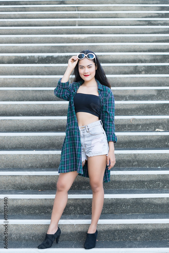 Portrait of beautiful asian woman,Hipsters girl on stair for take a picture,Thailand people