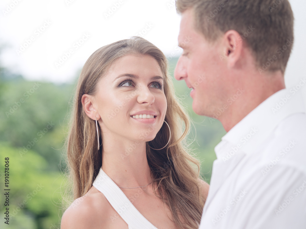portrait of nice young couple on summer background portrait of nice young couple on summer background