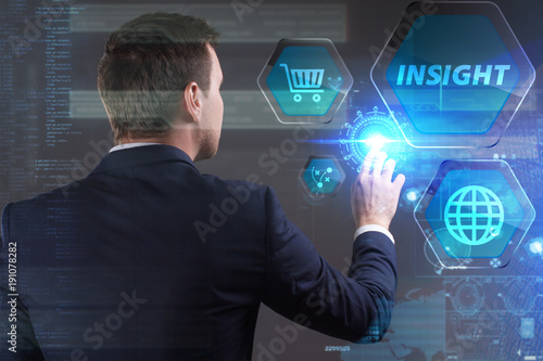 Business, Technology, Internet and network concept. Young businessman working on a virtual screen of the future and sees the inscription: Insight