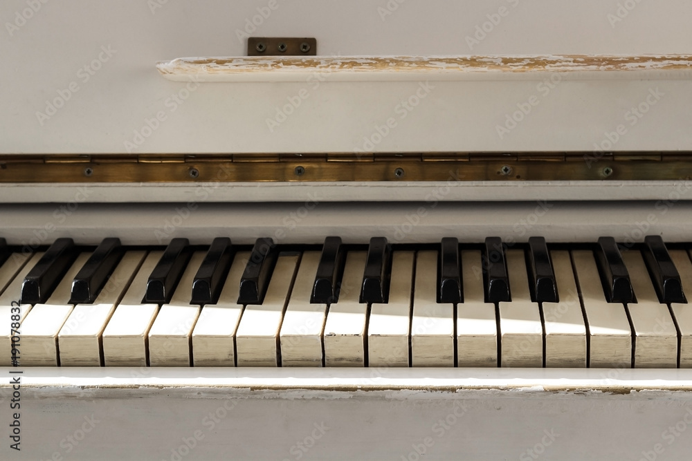 White pianoforte, front view instrument, musical instrument. learn to play the instrument at home. white large piano. piano keyboard. concert concept. White pianoforte, front view instrument, musical instrument. learn to play the instrument at home. white large piano. piano keyboard. concert concept.