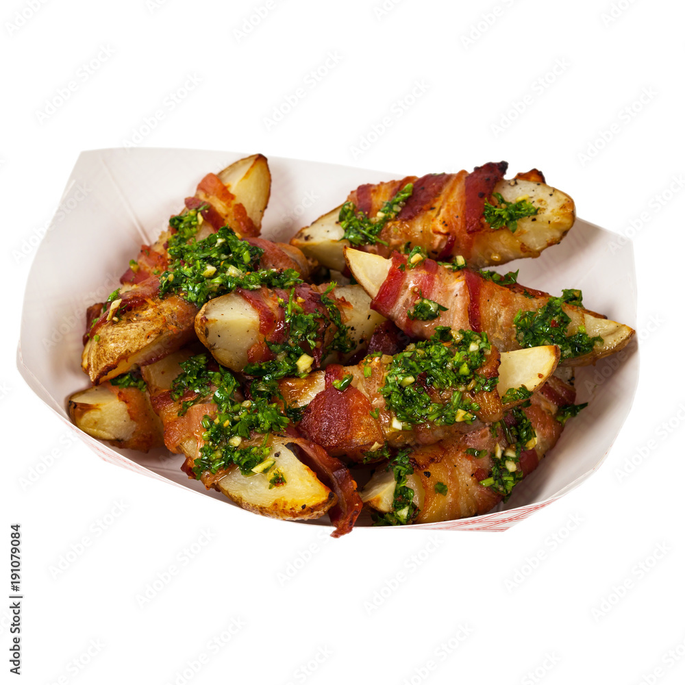 Bacon Wrapped Potatoes Wedges with Parsley Garlic Pesto Sauce Isolated on White background. Selective focus. Bacon Wrapped Potatoes Wedges with Parsley Garlic Pesto Sauce Isolated on White background. Selective focus.
