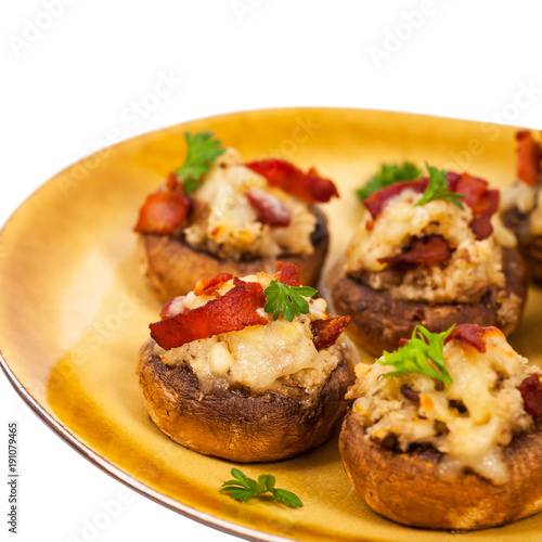 Stuffed Mushrooms with Bacon, Cheese and Breadcrumbs Isolated on White Background. Selective focus.