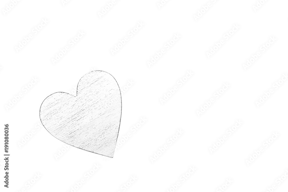 White wooden heart on black and white cardboard background.