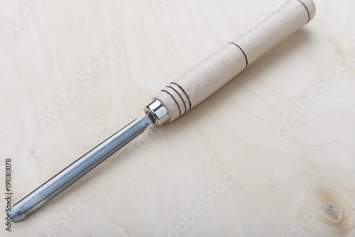 Professional chisels on a wooden background