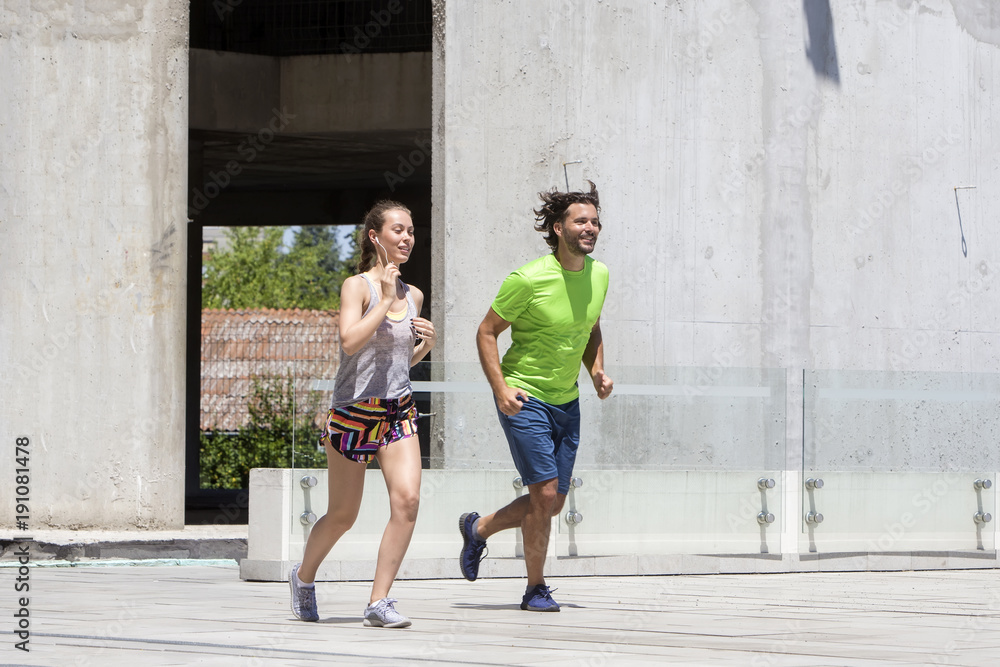 Couple running in urban enviroment