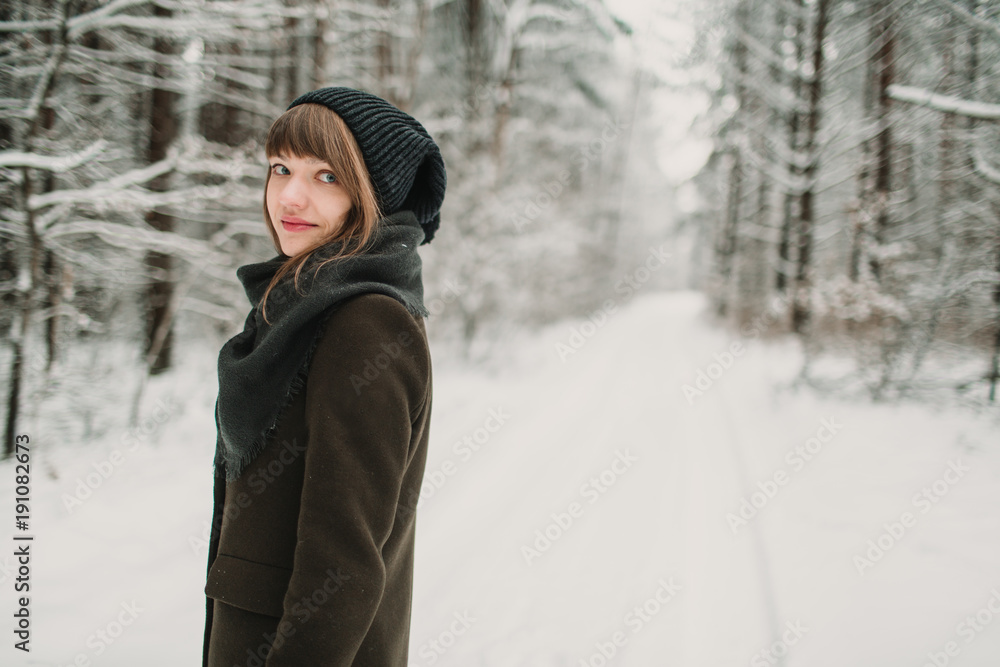 Cheerful woman in winter forest Cheerful woman in winter forest