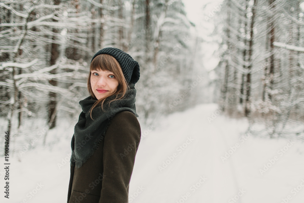 Cheerful woman in winter forest Cheerful woman in winter forest