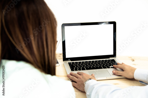 man and woman using computer