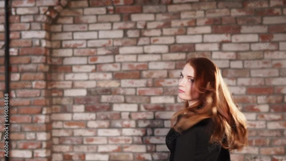 portrait of a young and pretty woman with red hair who poses against a brick wall background, a lady with natural makeup looks happy and sweet portrait of a young and pretty woman with red hair who poses against a brick wall background, a lady with natural makeup looks happy and sweet