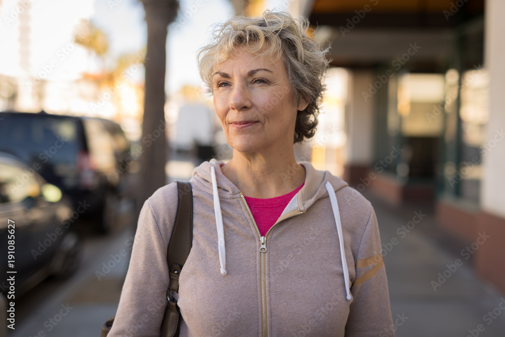 Mature caucasian woman serious face walking Mature caucasian woman serious face walking