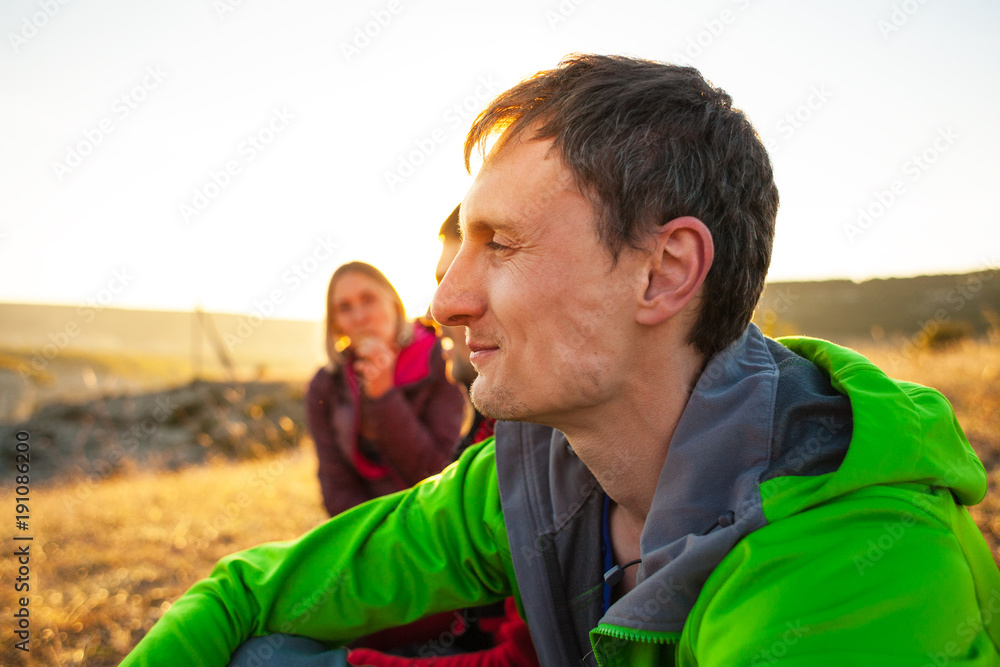 A man in the company of friends in nature. A man in the company of friends in nature.