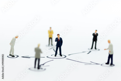 Miniature people: Businessman stand in various positions. Image use for business cycle, responsibility.