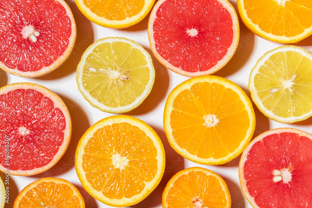 Assorted sliced fruits on white background. Flat lay. Food vegan concept. Assorted sliced fruits on white background. Flat lay. Food vegan concept.