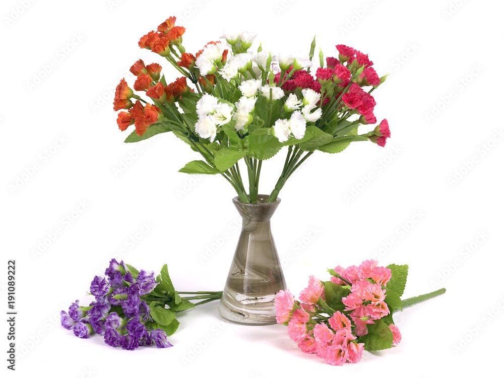 Obraz premium Multicolored flowers in a vase isolated on white background
