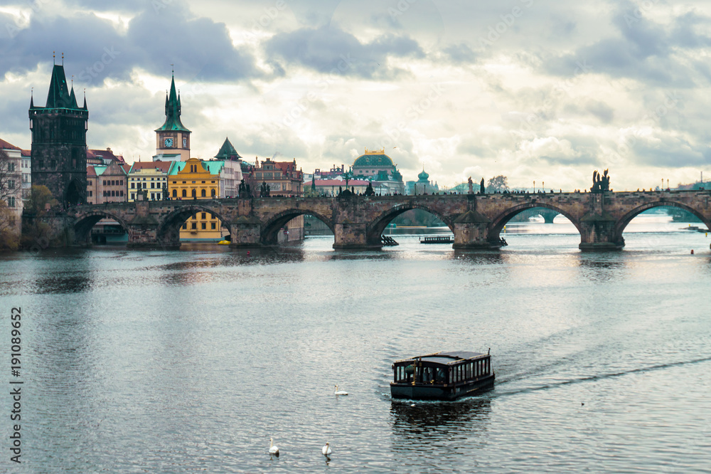 Panoramic view of Charles Bridge in Prague in a beautiful autumn day, Czech Republic. Concept of Europe travel, sightseeing and tourism.