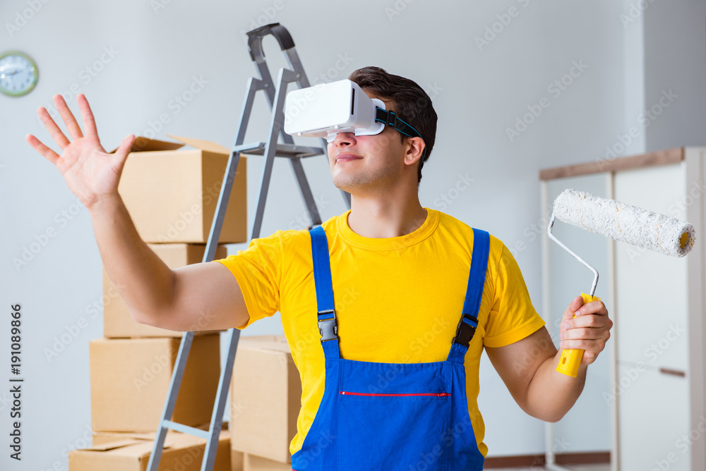 Painter contractor working with virtual reality goggles Painter contractor working with virtual reality goggles