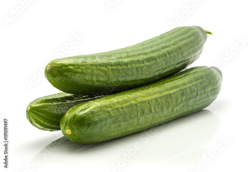 Three European cucumbers (burpless, seedless, hothouse, gourmet, greenhouse, English cucumber) isolated on white background.