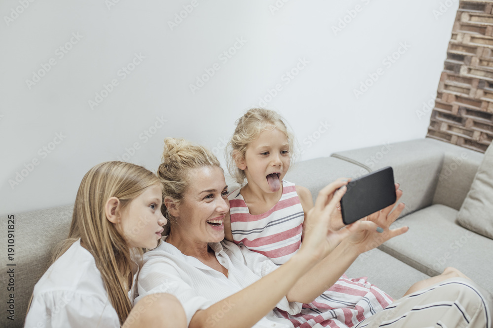 Mother and Children Using Cell Phone Camera Mother and Children Using Cell Phone Camera