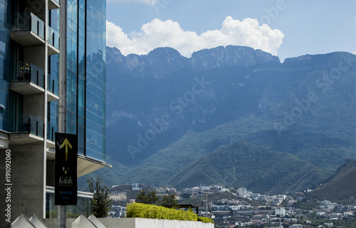 Skyscraper and mountains