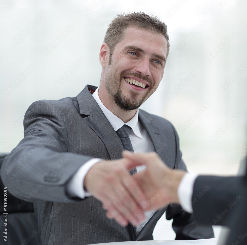 closeup .businessman holds out his hand for a handshake. closeup .businessman holds out his hand for a handshake.