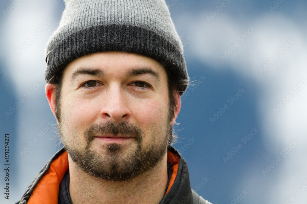 man wearing winter cap with a smile man wearing winter cap with a smile
