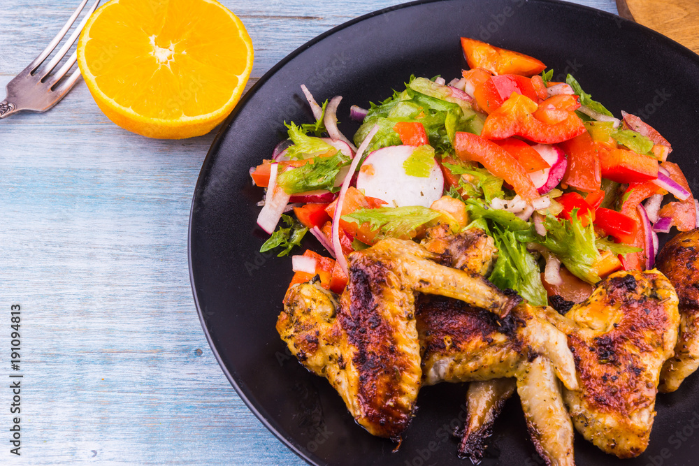 Fried chicken wings in the Caribbean with orange Fried chicken wings in the Caribbean with orange