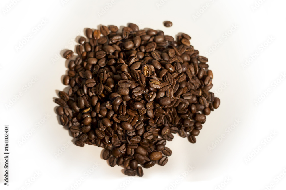 Isolated pile of fresh coffee beans Isolated pile of fresh coffee beans