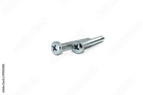 A couple of isolated galvanized industrial steel screws on white background © Maxamillion