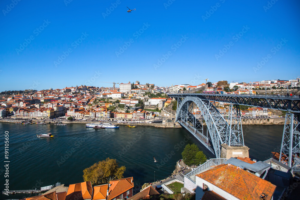 Bird's-eye view Douro river and Dom Luis I bridge, shot from Vila Nova de Gaia, Porto, Portugal.