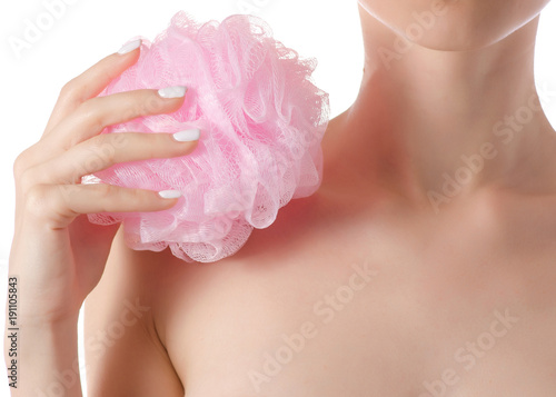 Beautiful young woman shoulder a bath sponge