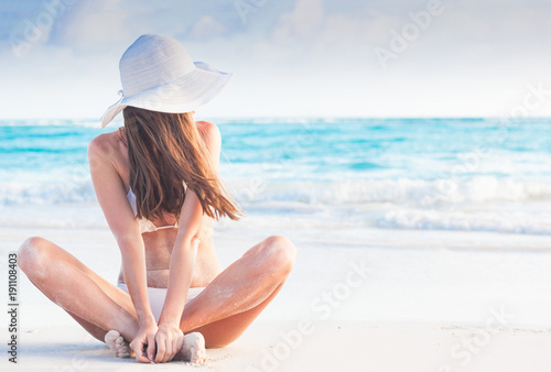 portrit of young woman in sun hat at beach