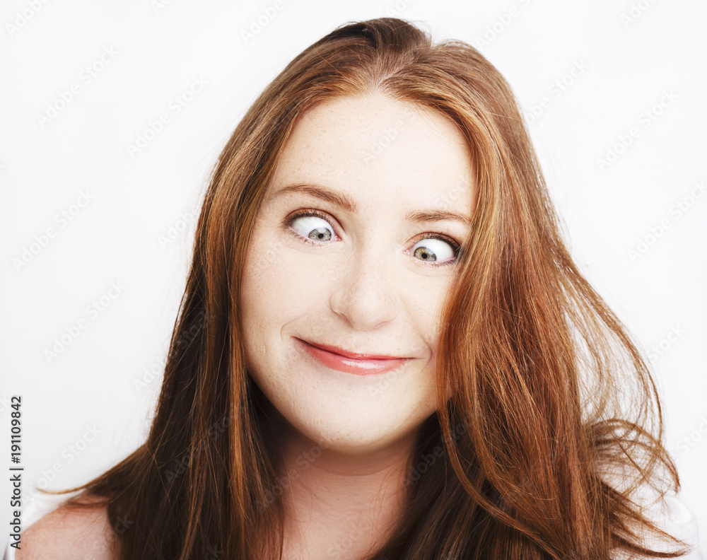 Beautiful young redhead woman with freckles portrait isolated on white Beautiful young redhead woman with freckles portrait isolated on white