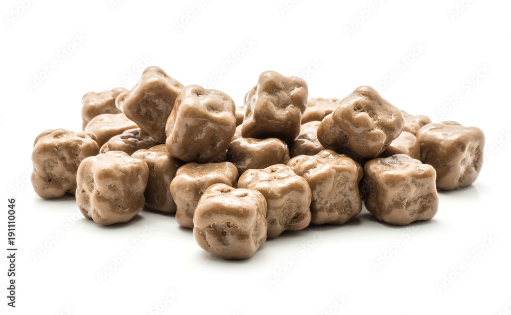Milk chocolate coconut cubes stack isolated on white background. Milk chocolate coconut cubes stack isolated on white background.