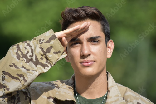 Saluting Young Colombian Male Soldier
