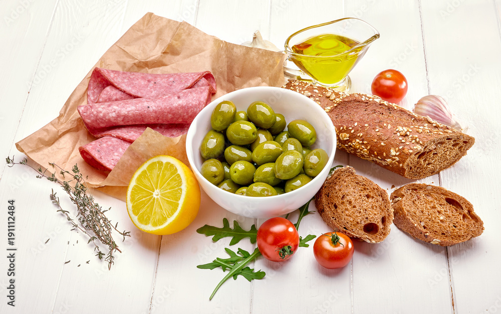 Delicacy with sausage olive and lemon lunch fresh bread snack Delicacy with sausage olive and lemon lunch fresh bread snack