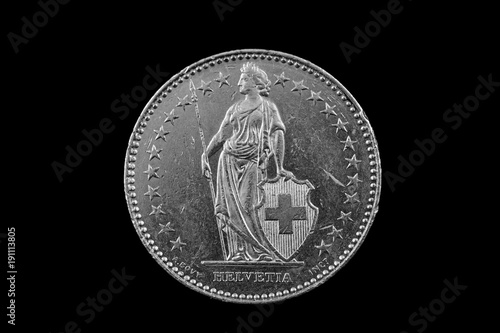 A macro image of a Swiss 2 Franc coin isolated on a black background