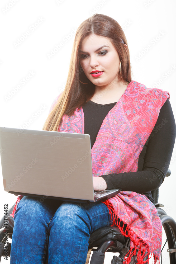 Naklejka premium Disabled lady surfing on web.