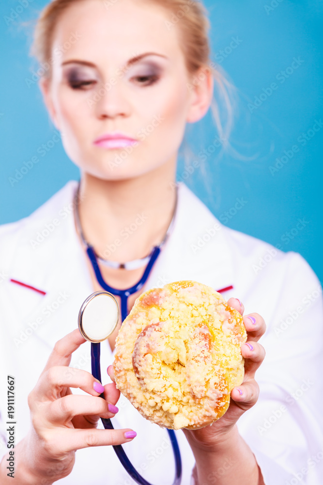 dietitian examine sweet roll bun with stethoscope