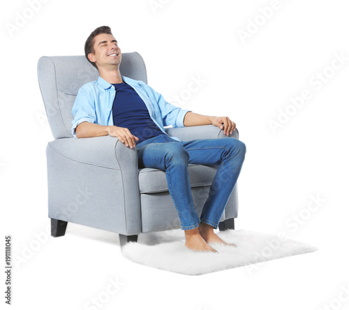 Young man relaxing in cozy ...