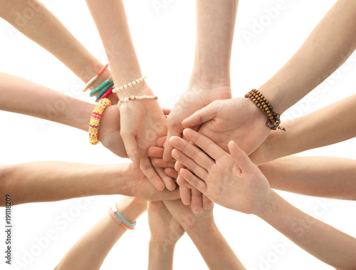 People putting hands together as symbol of unity