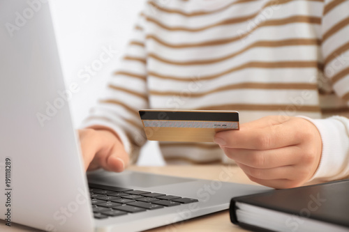 Woman with credit card and ...