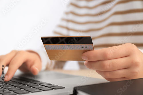 Woman with credit card and ...
